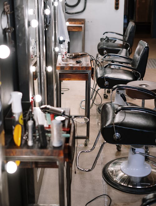 Free Black Leather Barber Chair in Front of Mirror Stock Photo