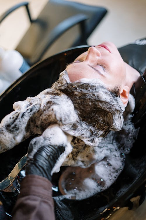 Free Woman Getting Her Hair Shampoo Stock Photo