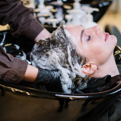 Hair being washed before styling