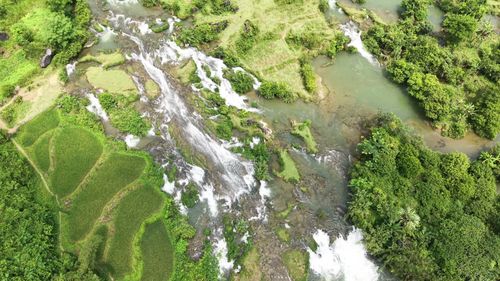 Free Stunning aerial view of the Doai Duong River flowing through lush greenery in Cao Bang, Vietnam. Stock Photo