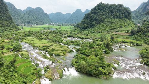 Free Aerial view of lush green valley and river in Doai Duong, Cao Bang, Vietnam. Stock Photo