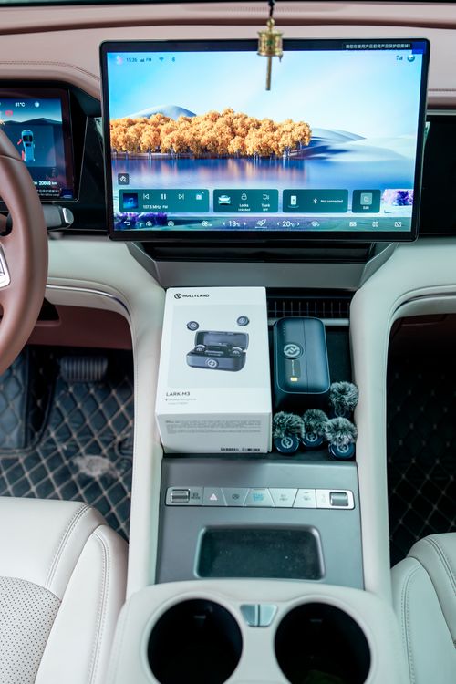Free Futuristic car interior featuring a digital dashboard and wireless microphone kit. Stock Photo