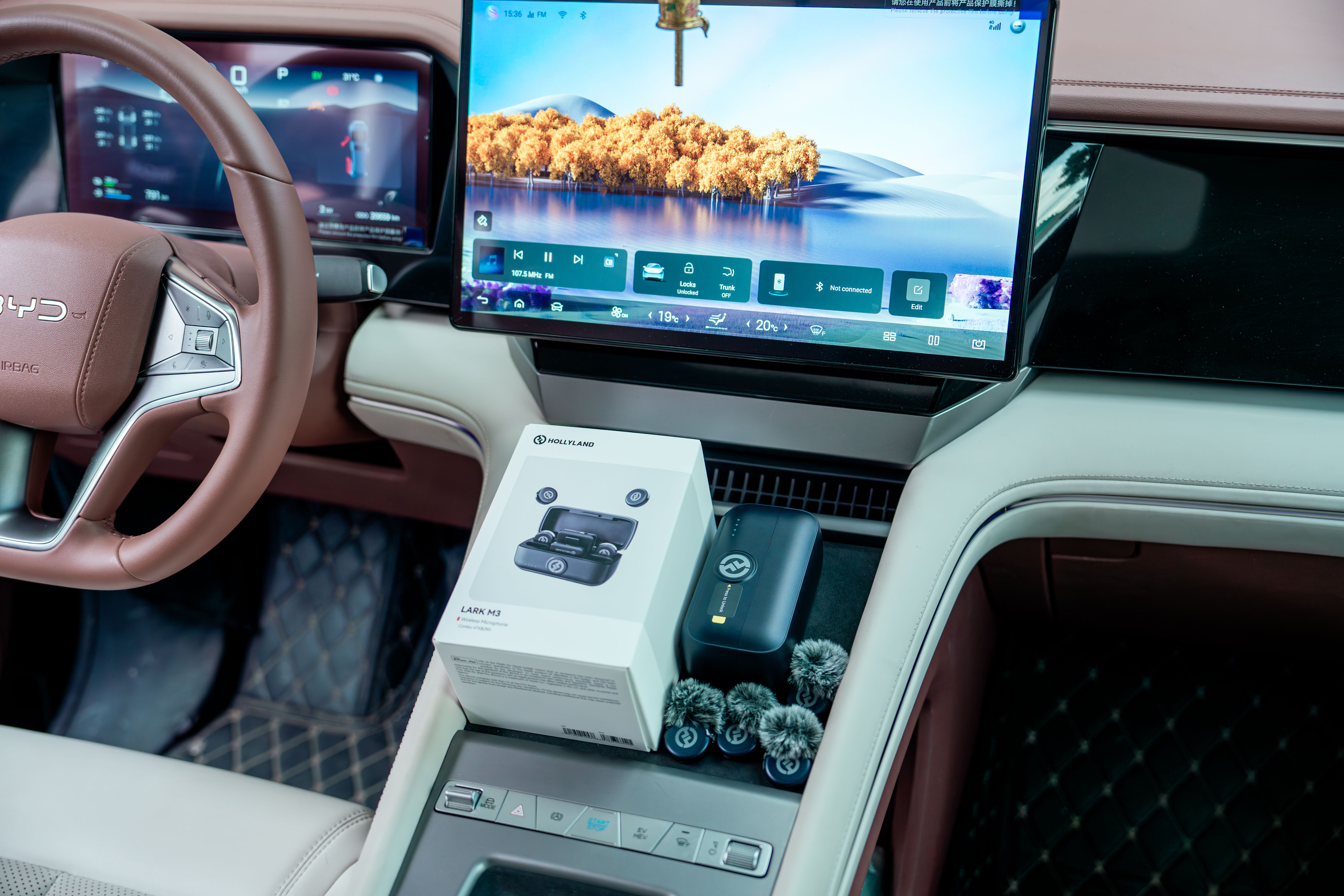 Modern electric vehicle interior with a digital dashboard display and tech controls.