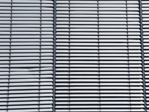 Free Close-up of a contemporary window blinds pattern showcasing symmetry and design. Stock Photo