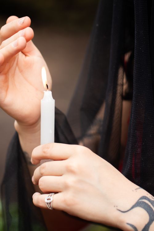 Free Close-up of hands holding a lit candle, evoking calm and introspection. Stock Photo