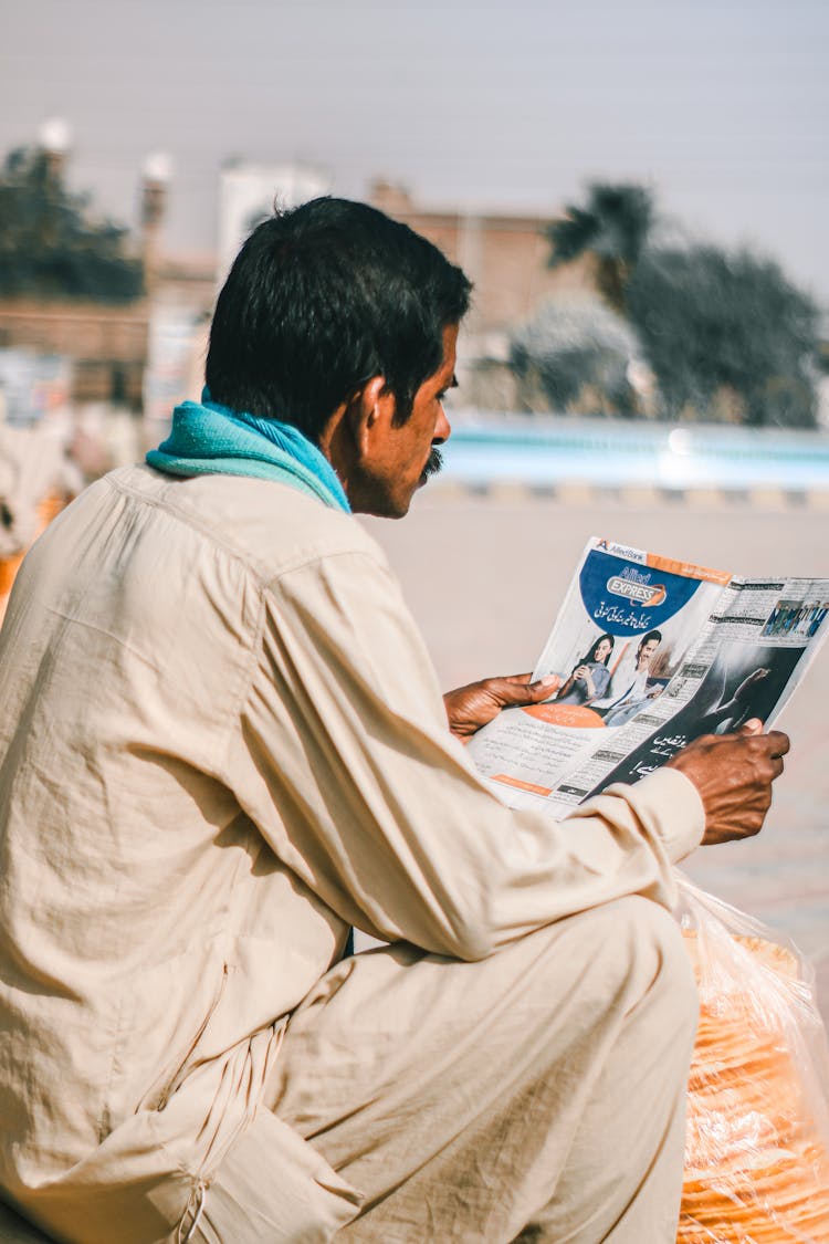 Man Reading A Magazine