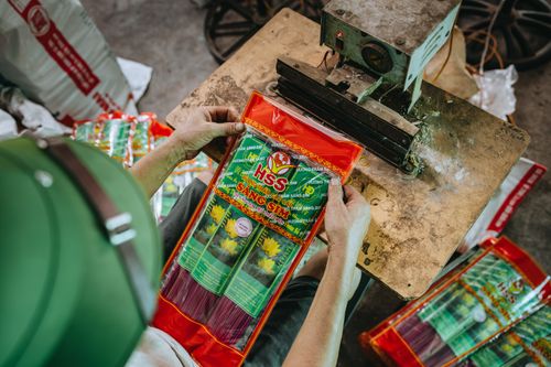 Free A detailed look at the incense packaging process in a traditional workshop setting. Stock Photo