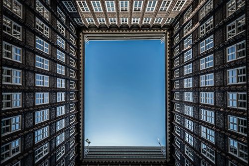 Free Looking up at the intricate brick facade architecture of Hamburg's iconic courtyard. Stock Photo