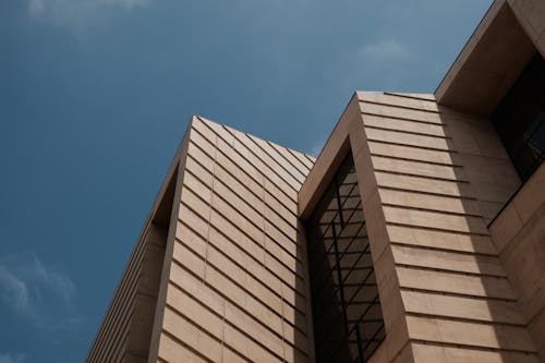 Brown Concrete Building Under Blue Sky