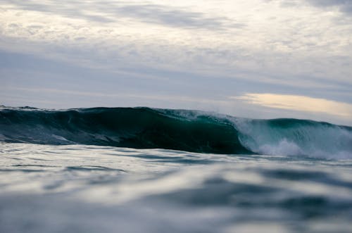 Ocean Waves Under White Clouds