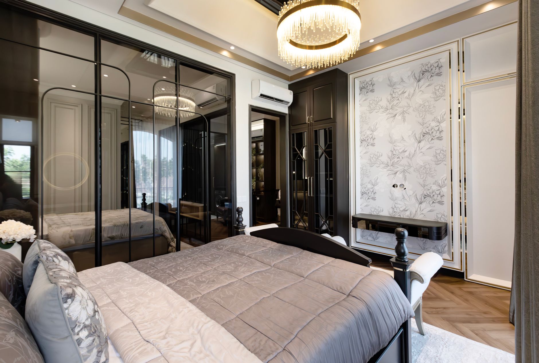 Elegant bedroom with modern decor, a plush bed, and stylish lighting.