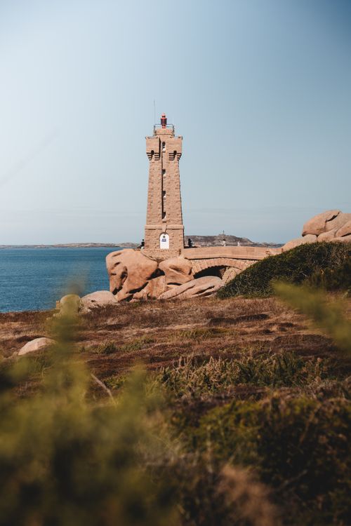 Free A picturesque lighthouse against the ocean in Trégastel, Brittany, showcasing natural beauty and maritime architecture. Stock Photo