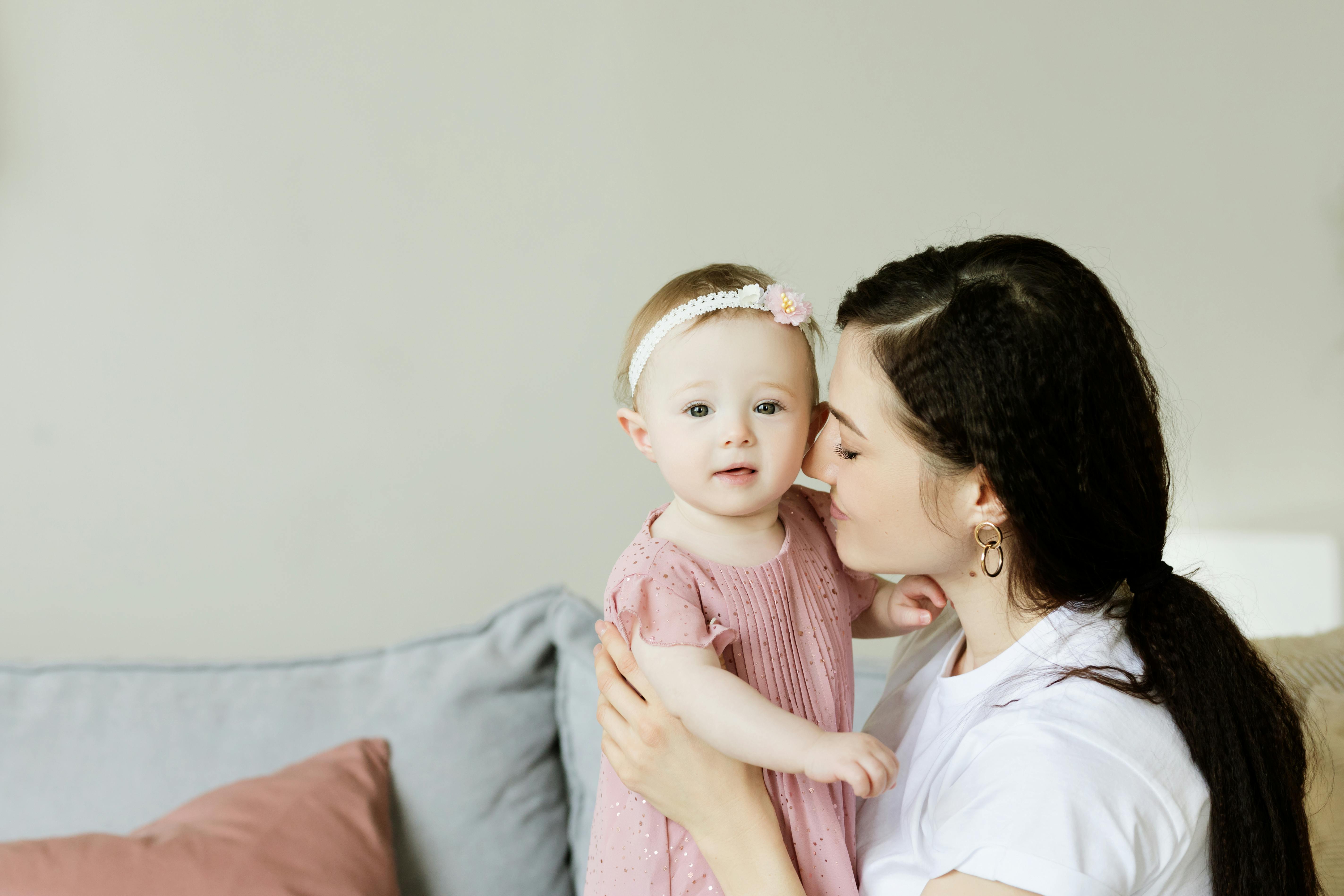 mother holding her cute daughter