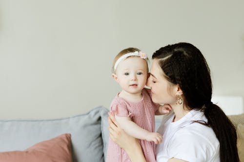 Free Mother Holding Her Cute Daughter Stock Photo