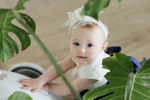 Free Baby in a White Headband  Stock Photo