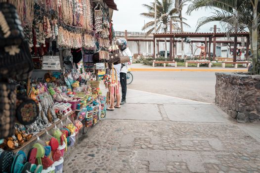 Explore the lively market stalls in Trujillo, Peru, filled with colorful souvenirs and local crafts.