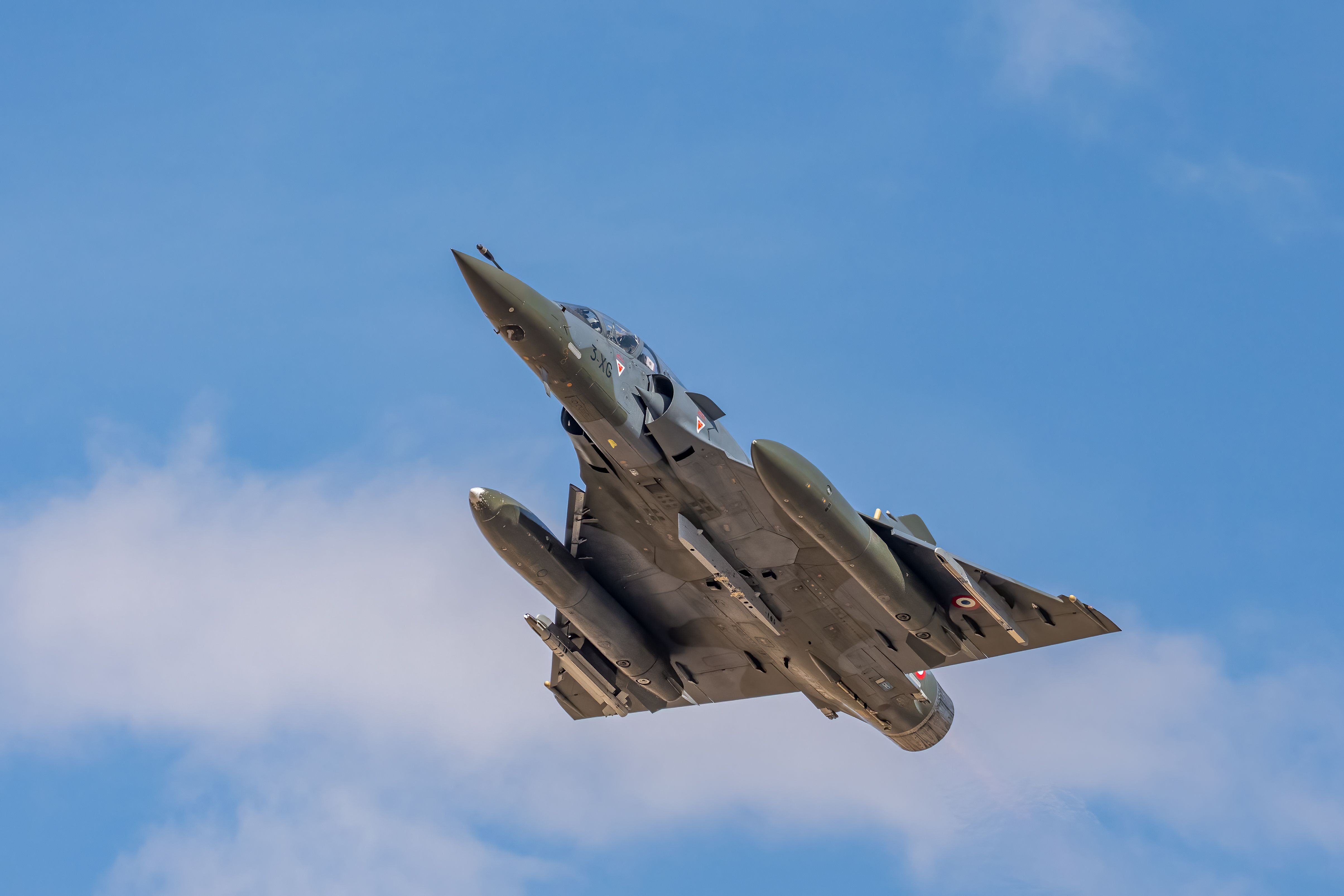 Dynamic shot of Dassault Mirage 2000 soaring in Albacete's sky.