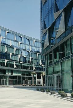 Contemporary office buildings with geometric facade in Dubai, UAE.