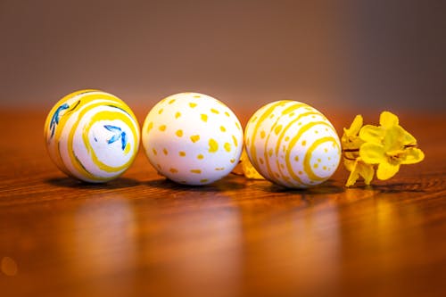 White and Yellow Egg on Brown Wooden Table