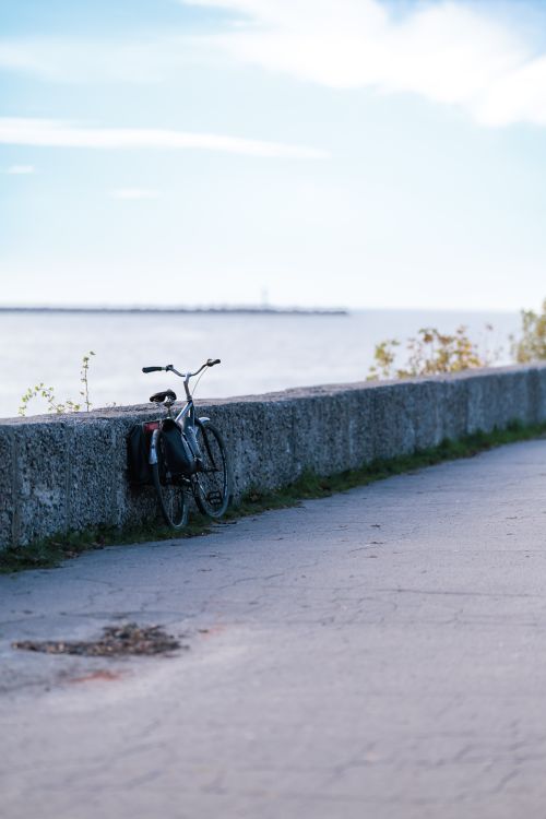 Free A bicycle rests by the sea along a quiet path in Baltiysk, Kaliningrad Oblast, Russia. Stock Photo