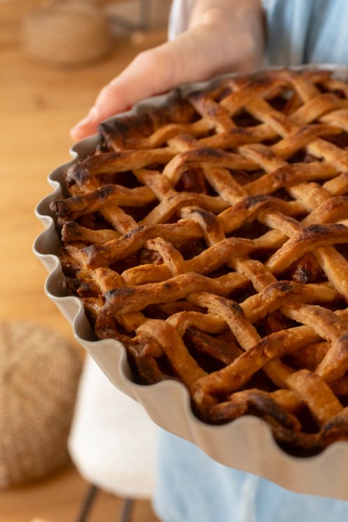 Free Delicious homemade lattice apple pie fresh from the oven, perfect for dessert. Stock Photo