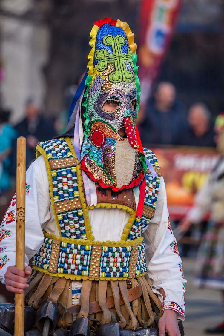 Person Wearing Yellow Blue And Red Mask