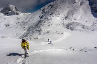 People Climbing Up Mountain