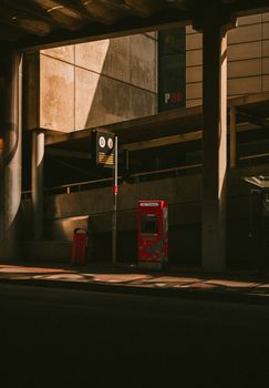 Moody afternoon light on an urban street in Amsterdam, capturing shadows and architecture.
