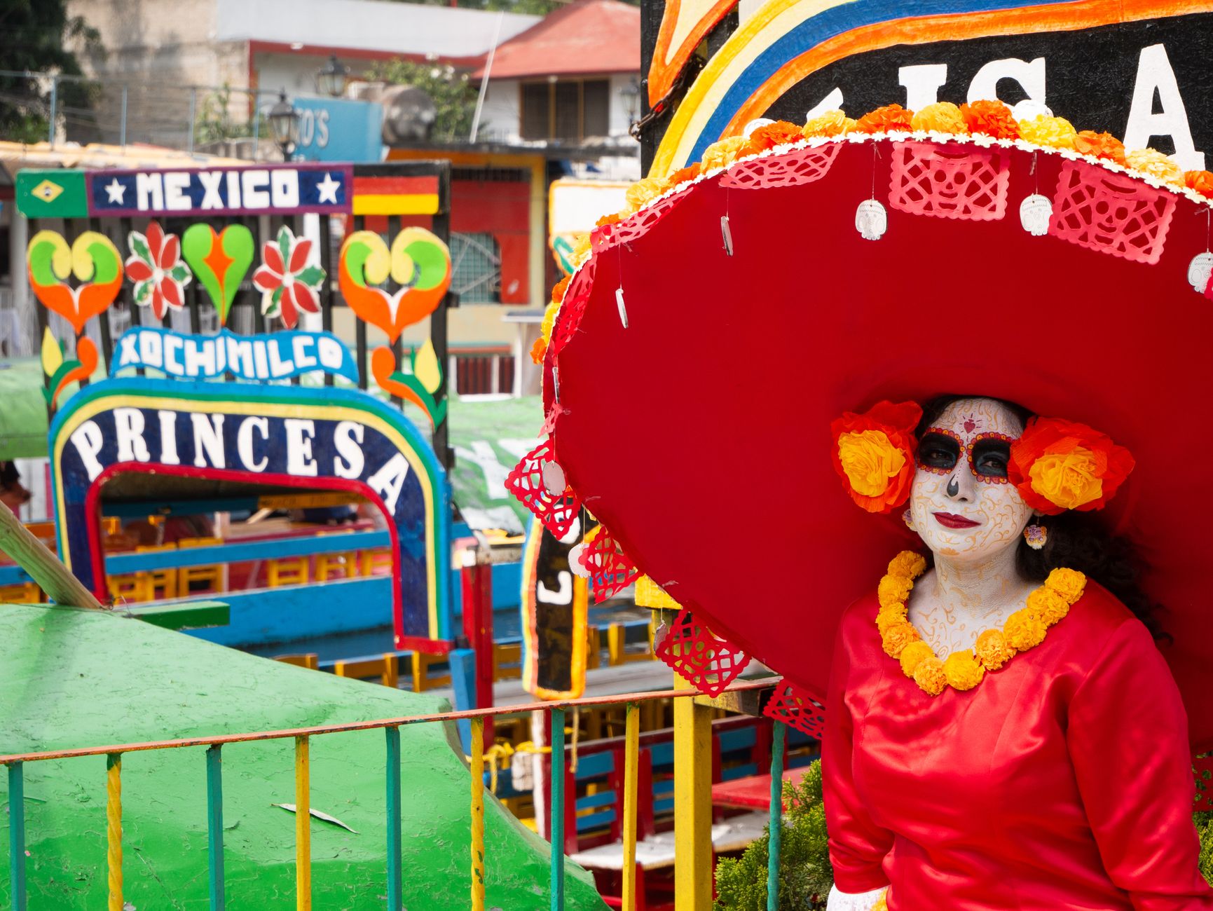 Colorful Day of the Dead scene with a Catrina character in Xochimilco, Mexico City.