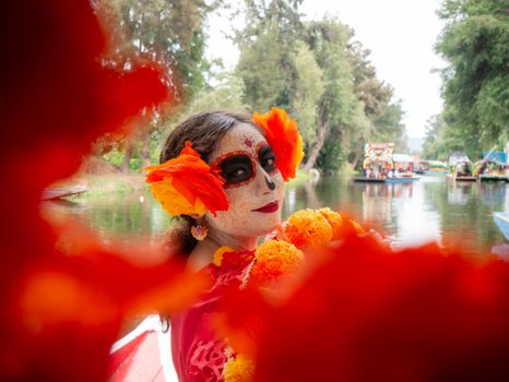 A colorful Day of the Dead celebration with a Catrina in Xochimilco, Mexico City.