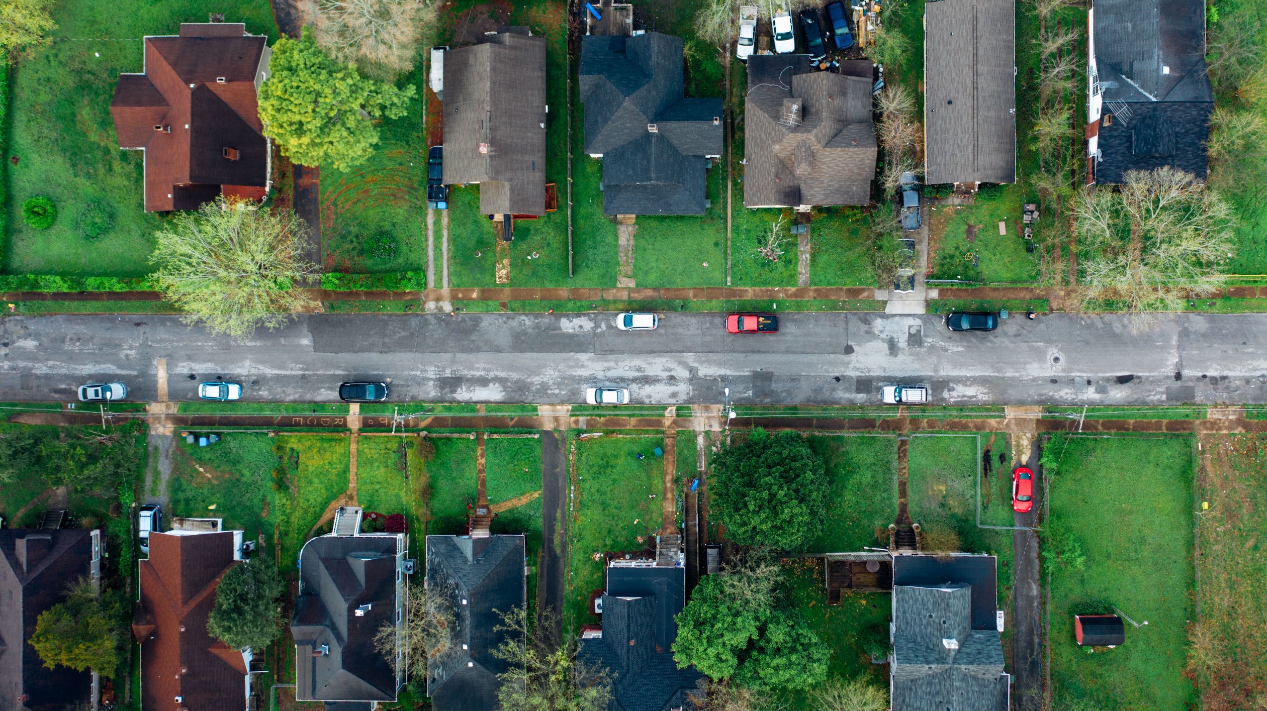 Aerial view of a Central Florida suburban neighborhood with tree-lined streets and family homes