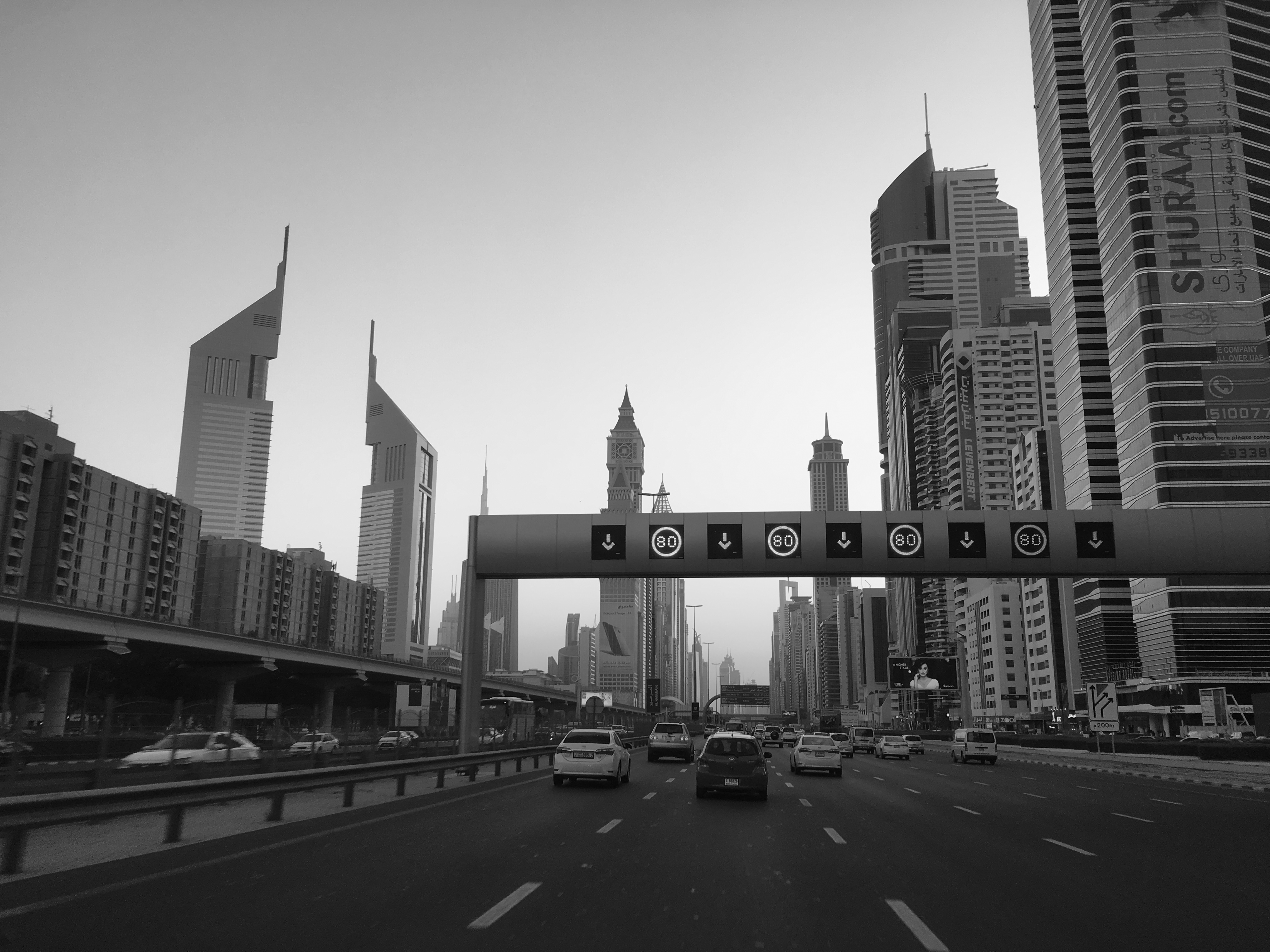 A black and white view of Dubai's iconic skyline from Sheikh Zayed Road.