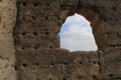 Free A close-up view of a historic fortress wall with a sky opening in Jerez de la Frontera, Spain. Stock Photo