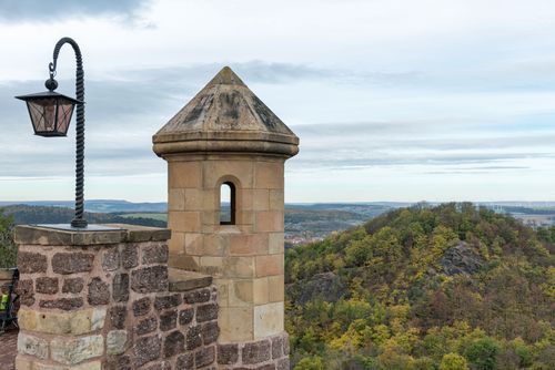 Free Wartburg Castle tower overlooking lush greenery in Eisenach, Germany. Stock Photo