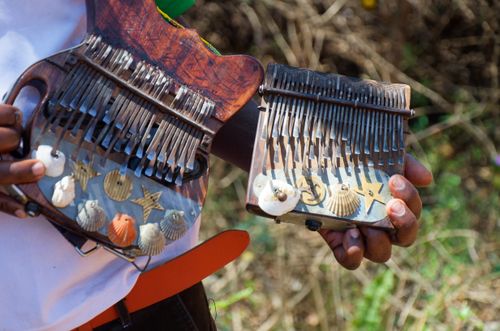Free Two wooden mbira instruments held outdoors, iconic in Zimbabwean music culture. Stock Photo