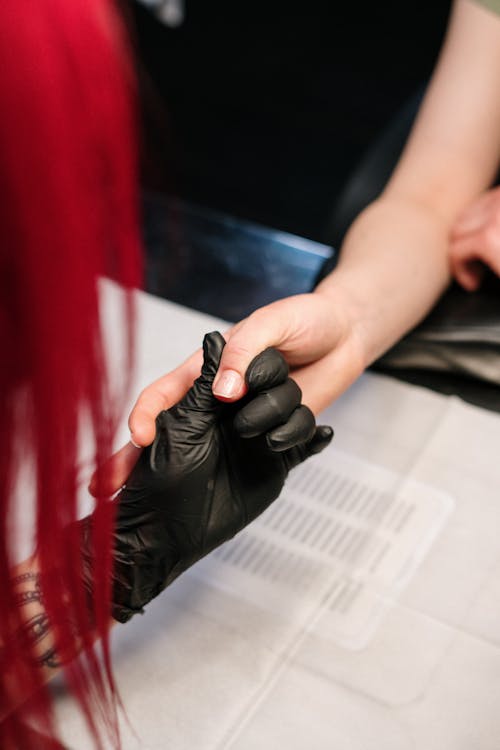 Person Holding Black Round Ornament