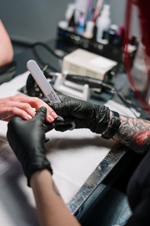 Free Person Wearing Black Gloves Doing Manicure Stock Photo