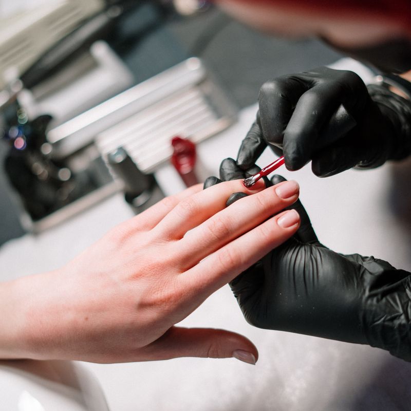 Custom gel nail art being applied at Nail Studio