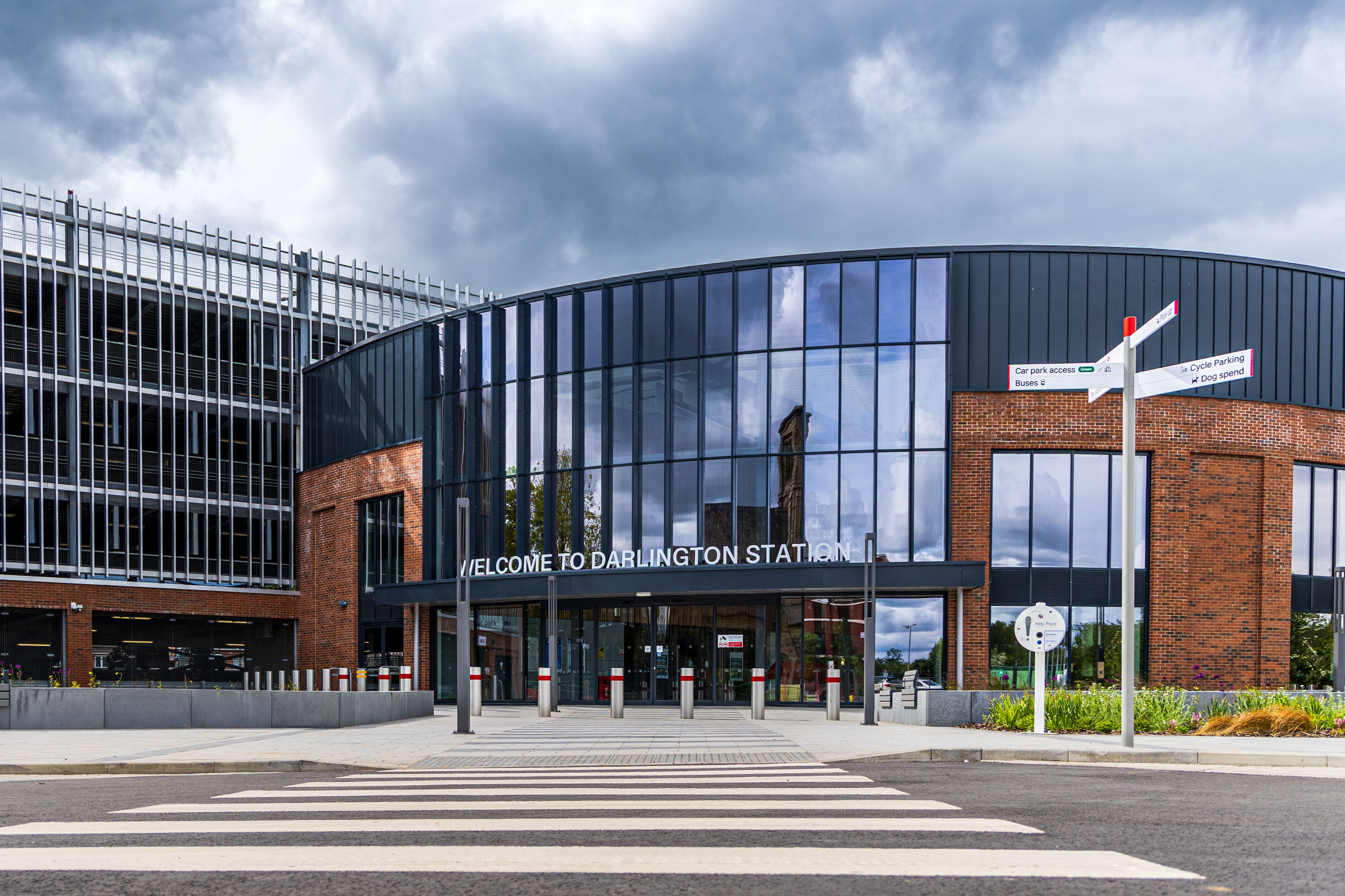 Front view of the newly designed Darlington Station under a dramatic sky.