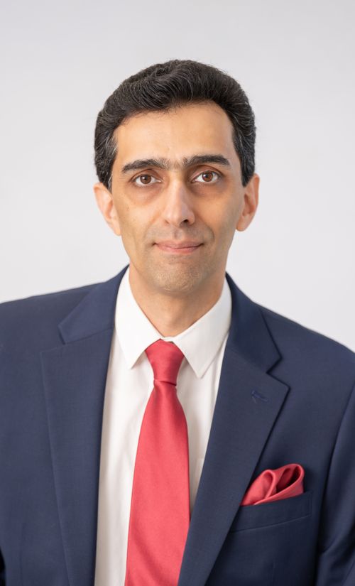 Free Confident businessman in blue suit and red tie, a formal executive portrait. Stock Photo