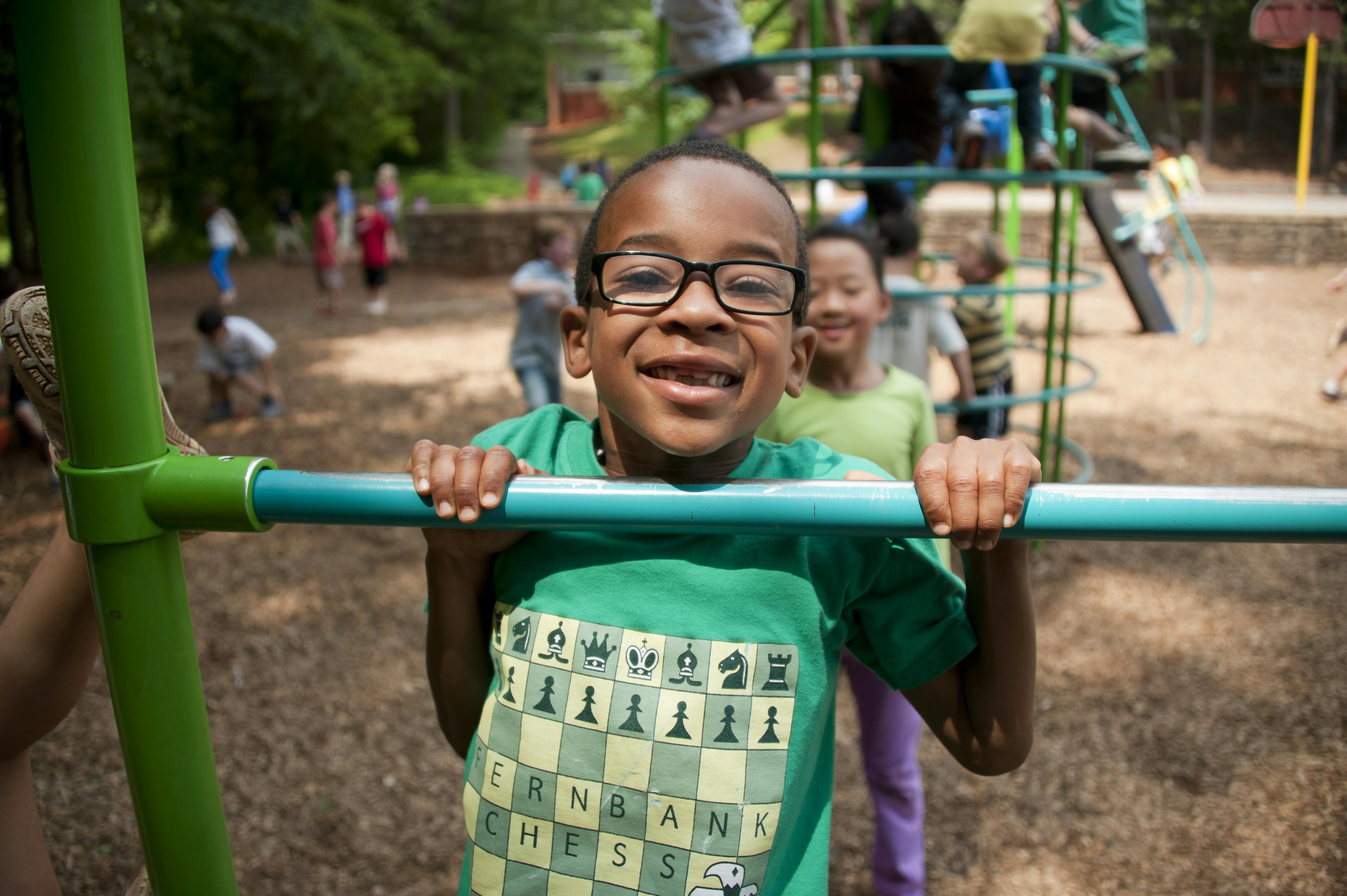 Free Boy in Green Crew Neck T-shirt Wearing Black Framed Eyeglasses Stock Photo