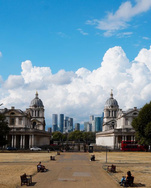 Free View of Greenwich with historical architecture, clouds, and city skyline. Stock Photo