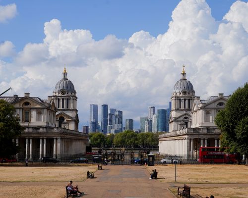 Free Old Royal Naval College in Greenwich with modern London skyline, London, UK. Stock Photo