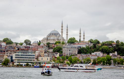Free Captivating view of Istanbul's skyline with the Suleymaniye Mosque amidst urban landscape and boats on the Bosphorus. Stock Photo