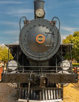 Detailed front view of vintage steam train engine 509, showcasing industrial design.