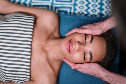 Free Man Lying on Blue and White Textile Stock Photo