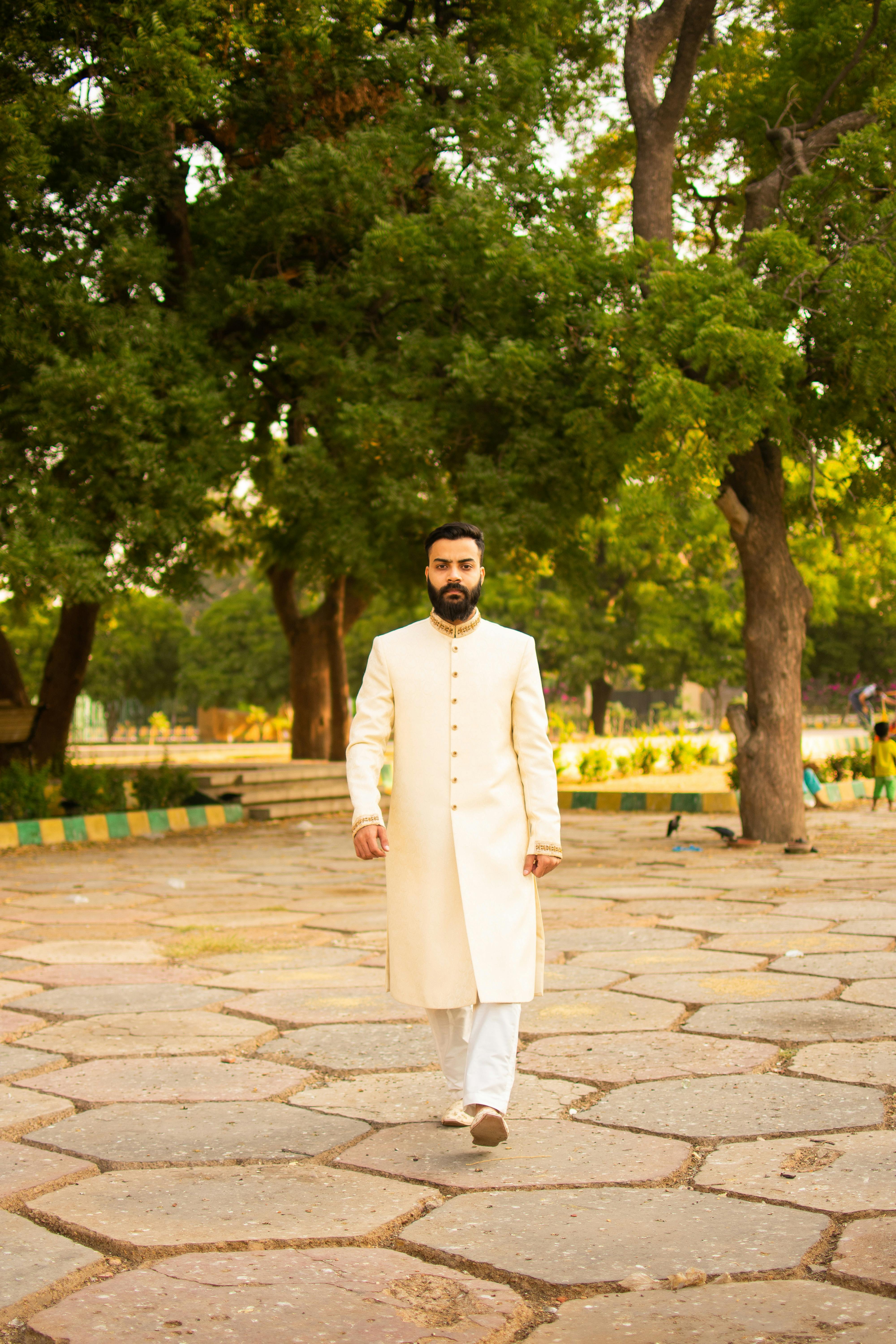 Man in White Indian Wedding Outfit