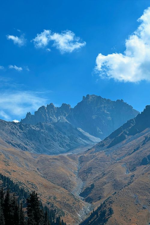 Free Breathtaking view of Talgar Mountains in Almaty Region, Kazakhstan with clear blue sky. Stock Photo