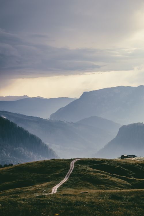 Free Explore the breathtaking landscapes of Trentino-Alto Adige, Italy, featuring verdant valleys and distant peaks. Stock Photo