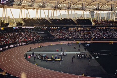 Free Packed arena scene showcasing a thrilling javelin event under twilight skies. Stock Photo